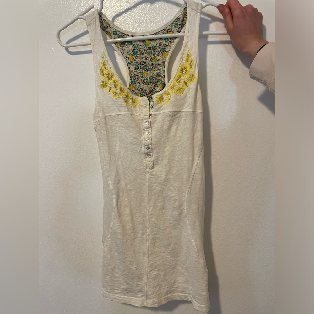 White tank top with yellow embroidered flowers